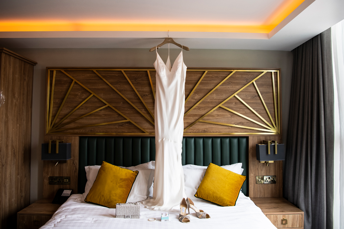 A wedding dress hangs in the bedroom of Iveagh Garden Hotel